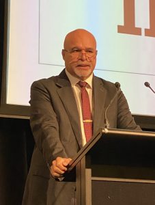 Minister John Rosso addresses the Forum